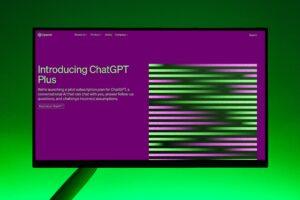 Close-up of a monitor displaying ChatGPT Plus introduction on a green background.
