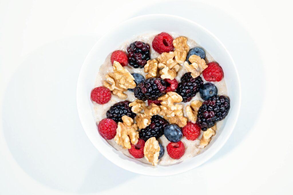 A vibrant bowl of mixed berries, walnuts, and oats for a nutritious start.